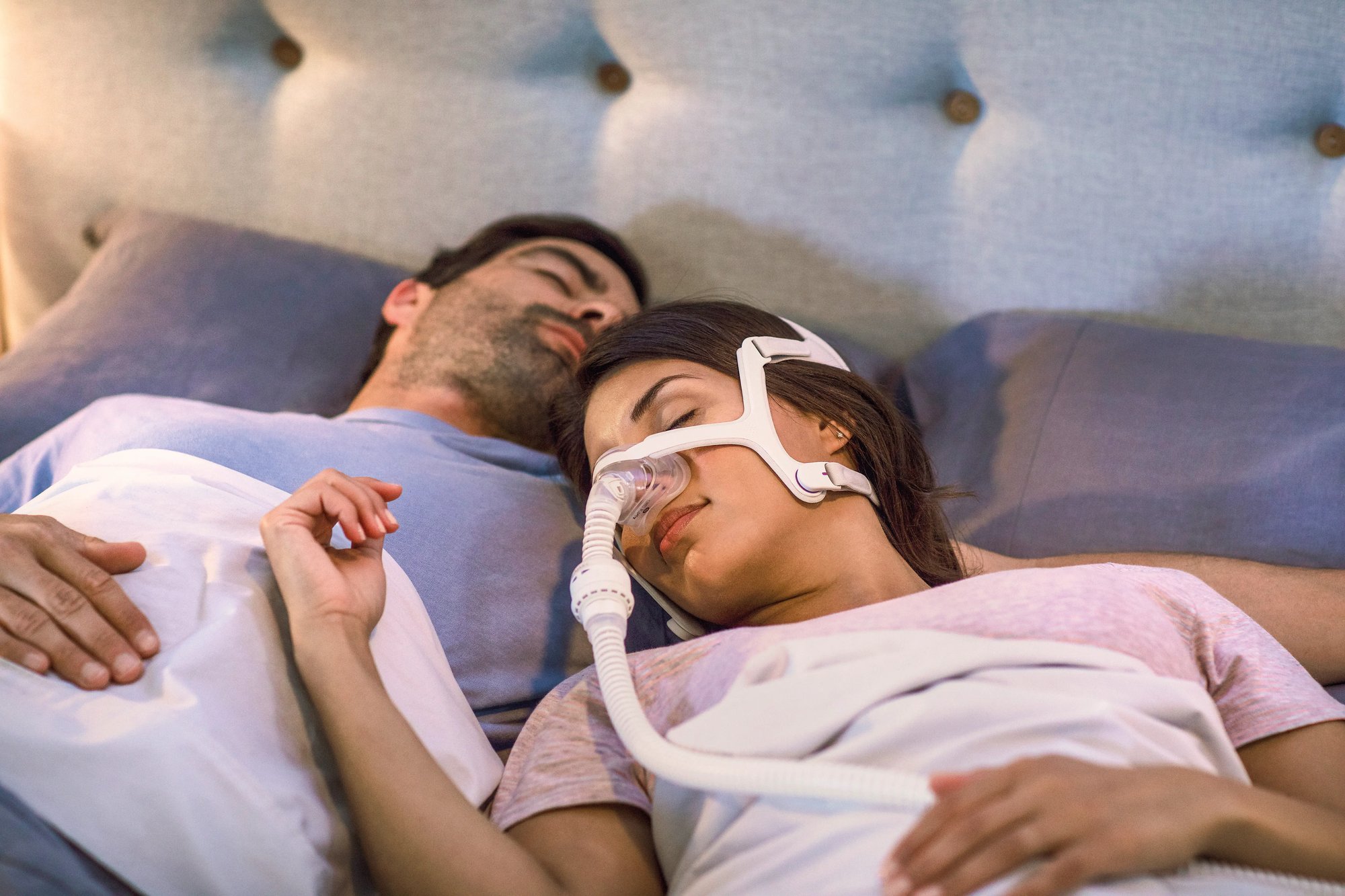 Person sleeping with a CPAP mask