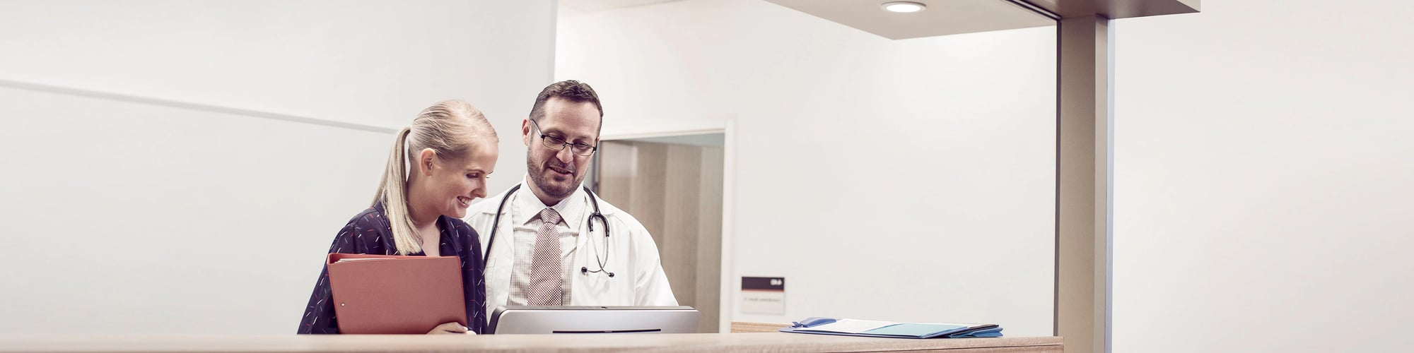 Doctor-and-nurse-behind-counter