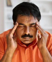 annoyed-with-closed-eyes-middle-aged-ill-male-hugged-pillow-isolated-pink-wall 1