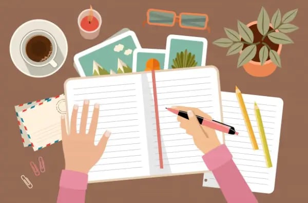 woman-s-hands-holding-pen-writing-diary