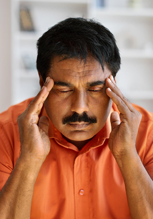 annoyed-with-closed-eyes-middle-aged-ill-male-hugged-pillow-isolated-pink-wall 1